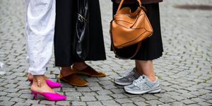 oslo, norway   august 28 nina sandbech wearing white pants, pink shoes and katarina petrovic wearing black coat with yellow collar and a guest wearing brown blazer, loewe bag seen during oslo fushion on august 28, 2019 in oslo, norway photo by christian vieriggetty images