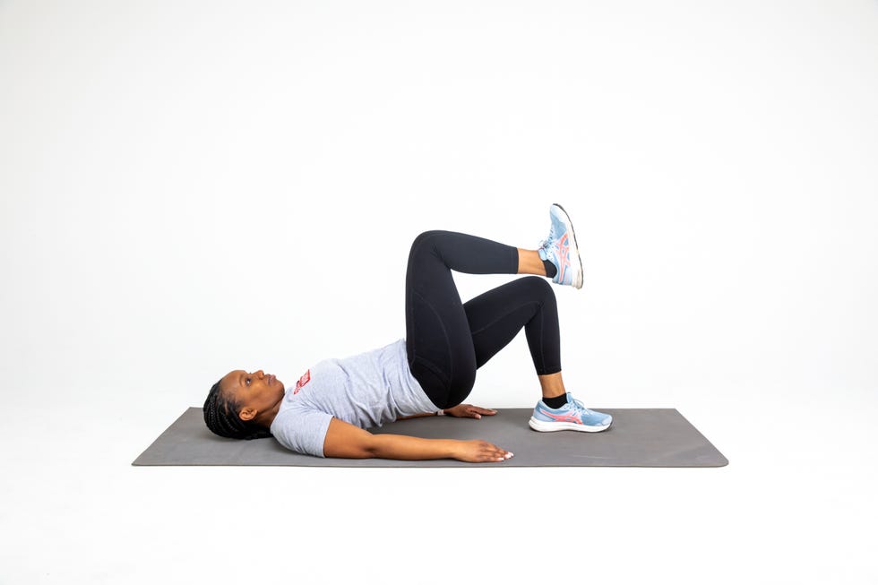 a woman doing strength exercises against a white background