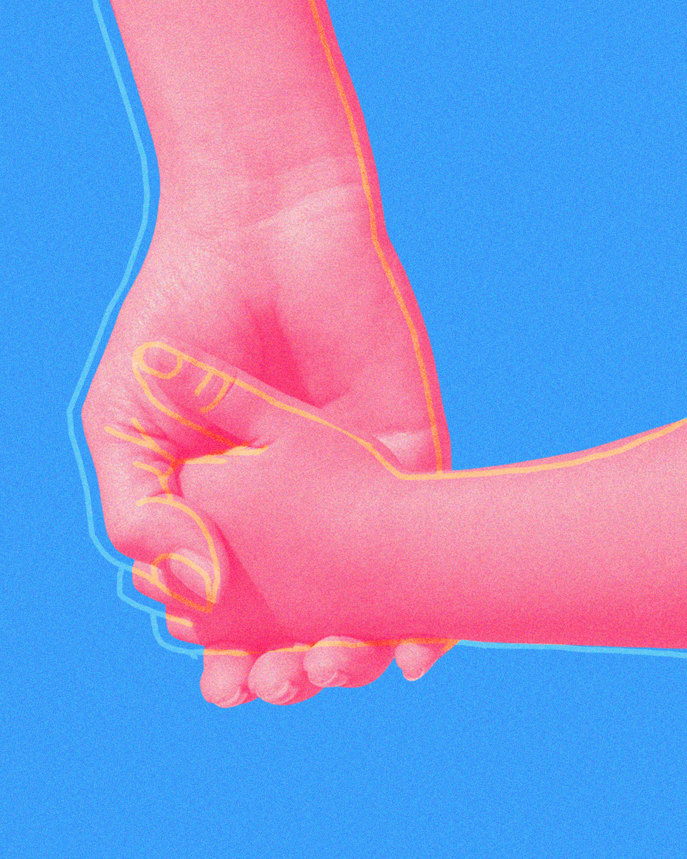 parent and child holding hands, close up