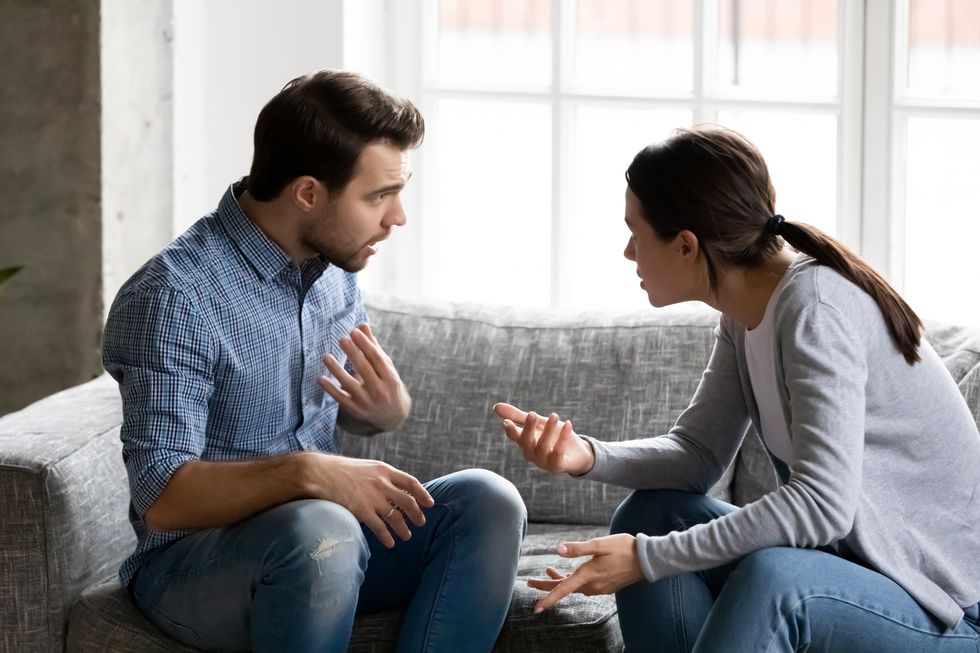 stressed young married family couple arguing, blaming each other