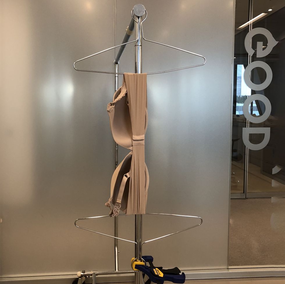 a bra being tested for stretch recovery at the good housekeeping institute in the textiles lab