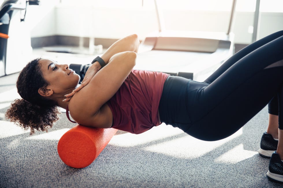 stretching her upper back