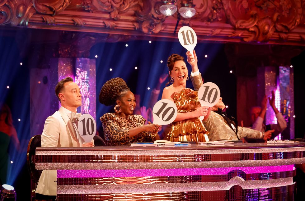 strictly judges hold their 10 scoring paddles during blackpool special