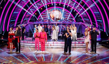 strictly come dancing 2023 week 7, the couples stand in front of the steps in their costumes