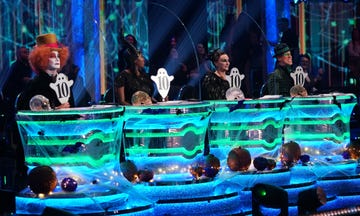 strictly come dancing judges craig revel horwood, motsi mabuse, shirley ballas and anton du beke hold up their ghost shaped 10 paddles on halloween week