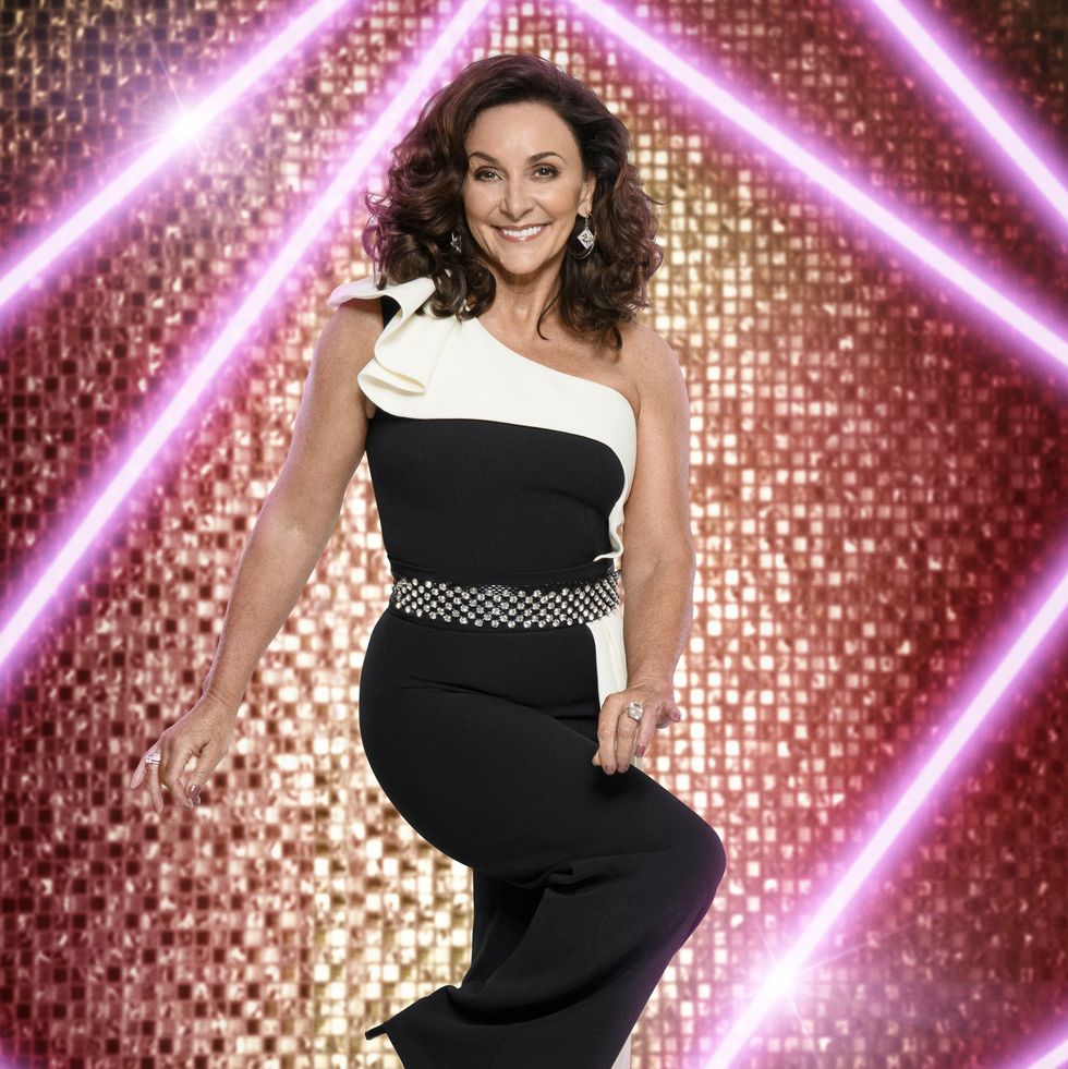 shirley ballas posing in a black and white dress for strictly come dancing