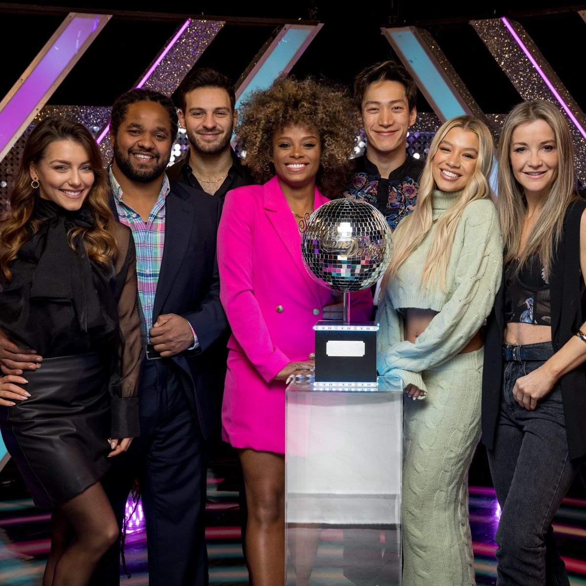 strictly come dancing finalists jowita hamza vito fleur carlos mollie helen and gorka stand round glitterball trophy
