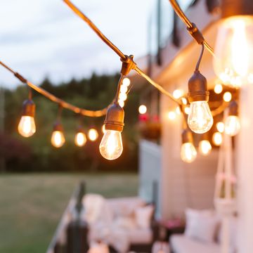 string lights over deck outside house