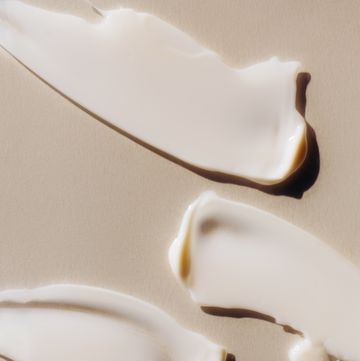 strokes of cream on piece of glass