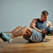 strong man doing exercise with med ballphoto of man perfect physique on grey backgroundstrength and motivation