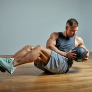 strong man doing exercise with med ballphoto of man perfect physique on grey backgroundstrength and motivation