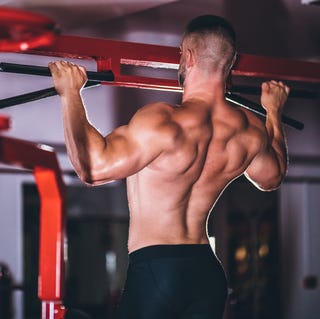 strong man doing pull up exercise