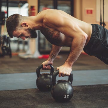 Strong man is doing cross training exercise