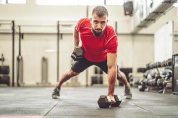 strong man is doing cross training exercise