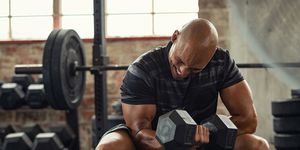 strong man lifting weight at gym