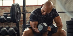 strong man lifting weight at gym