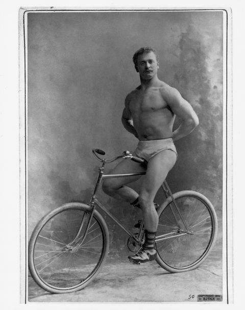 Strongman Eugene Sandow Sitting on Bicycle