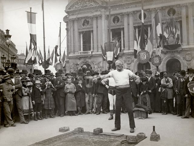 strongman on the place de l'opera in paris