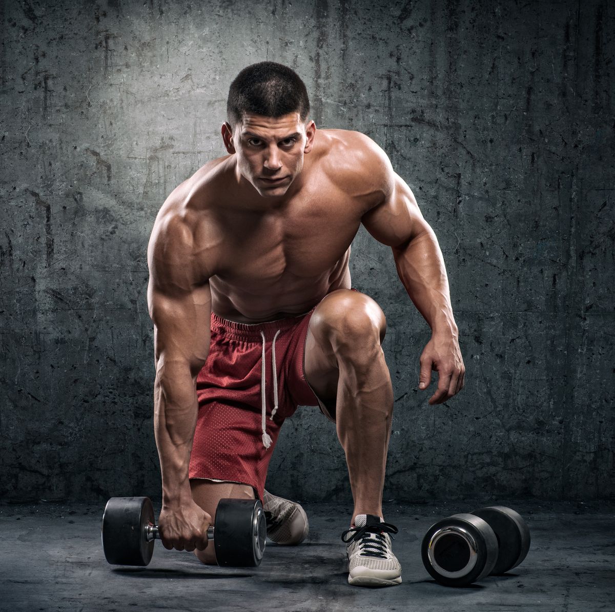 Strongman with dumbbells