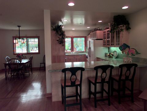 a look from the family room across the granite top counter of the