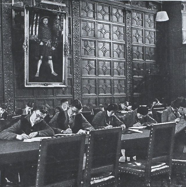 students doing an examination in trinity college, cambridge