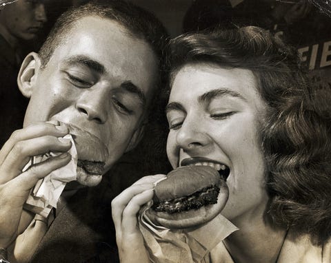 couple eating hamburgers