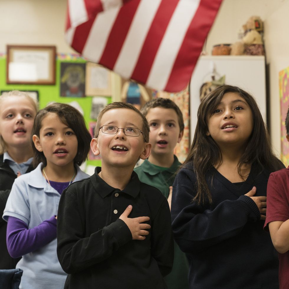students standing for pledge of allegiance