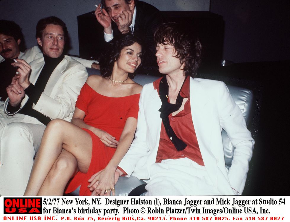 378283 03 5277 new york, ny fashion designer halston l with bianca  mick jagger at studio 54 for bianca's birthday party photo by robin platzertwin images  online usa