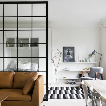 minimalist studio apartment with glass partition