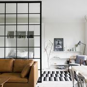 minimalist studio apartment with glass partition
