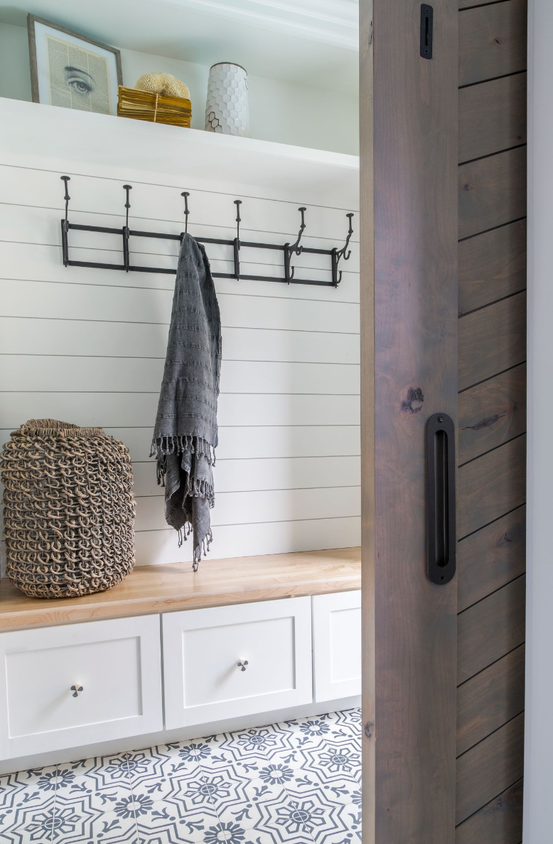 studio apartment ideas, space with hooks with a blanket hanging