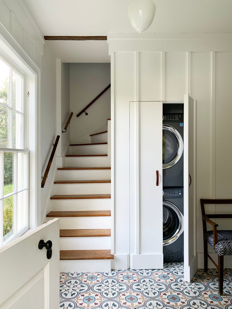 a laundry room with colorful tiles