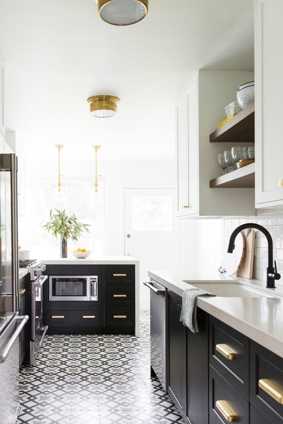 White galley kitchen with floral wallpaper