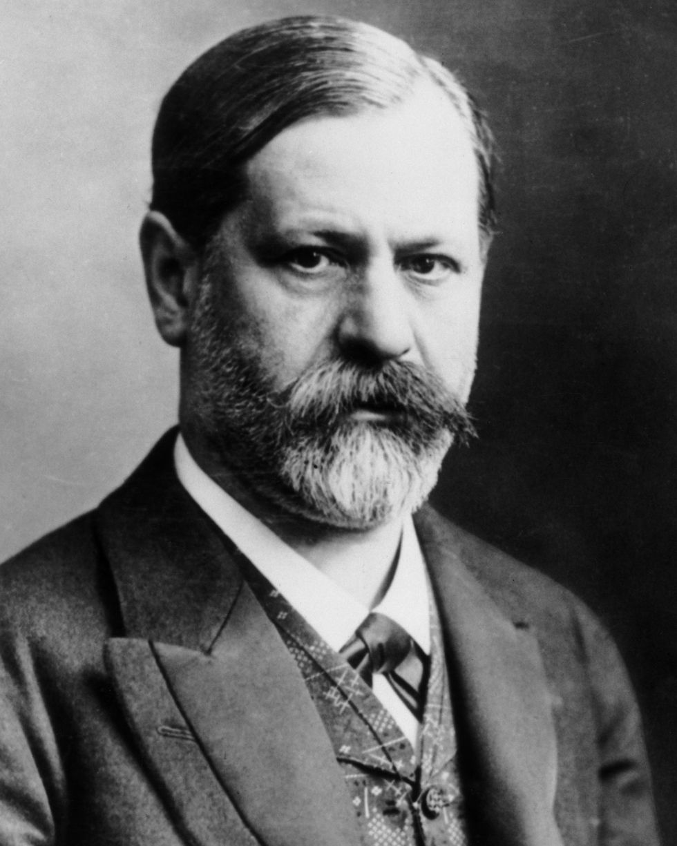 sigmund freud wearing a suit and bowtie as he looks forward for a photograph