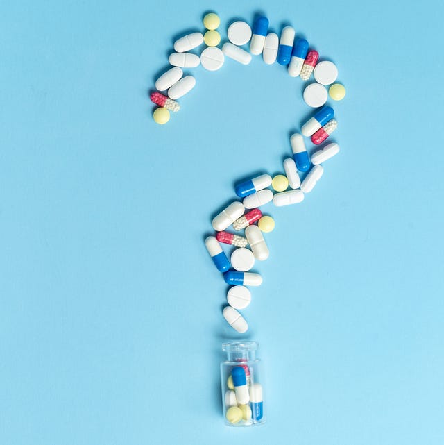 studio shot of medical pills on blue background