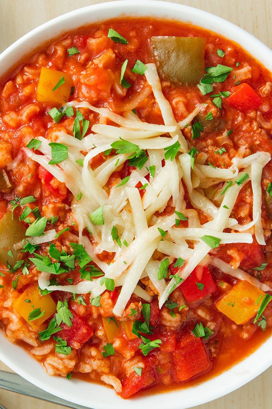 Stuffed Pepper Soup stuffed pepper soup in a bowl topped with shredded cheese
