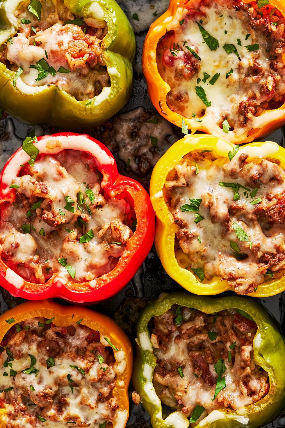 colorful stuffed peppers with ground beef and tomato rice