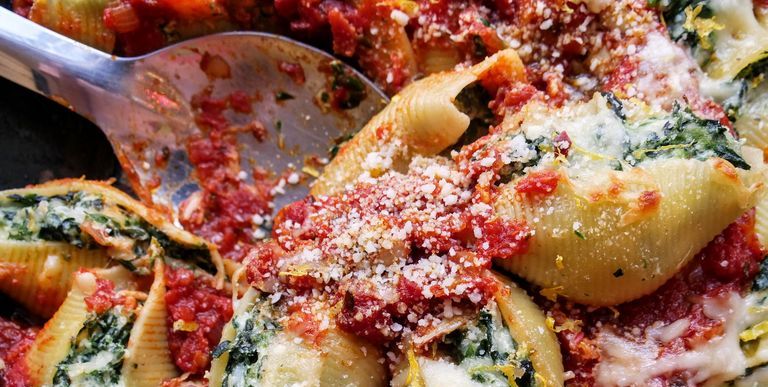 pasta shells stuffed with tomato sauce, cheese, and spinach