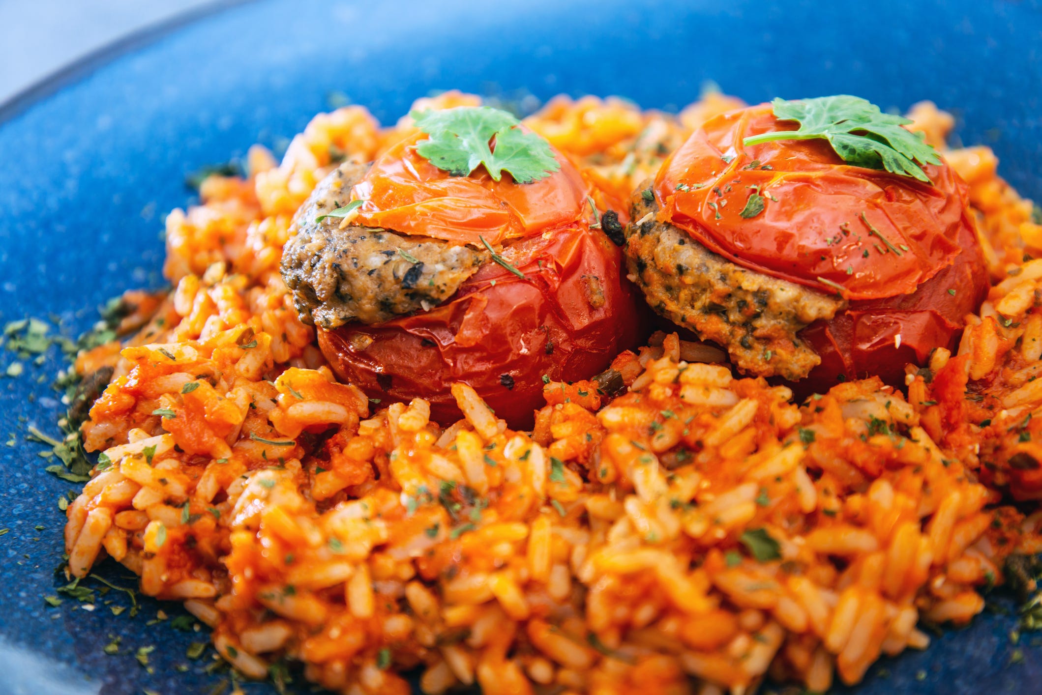 stuffed tomatoes on rice