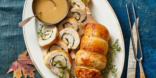 stuffed turkey breast with gravy served on the side