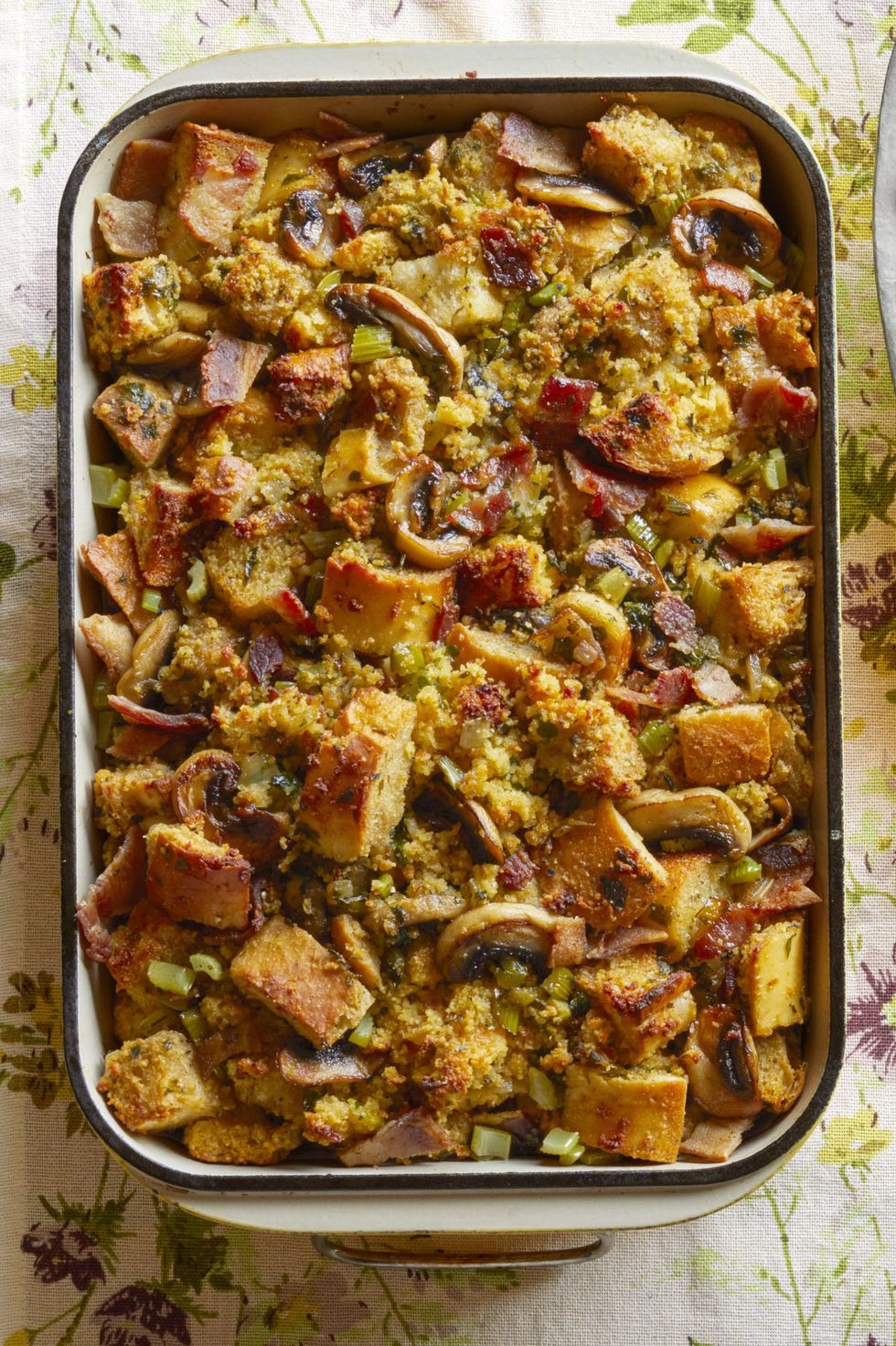 https://hips.hearstapps.com/hmg-prod/images/stuffing-recipes-cornbread-bacon-dressing-with-mushrooms-6549000cad368.jpeg?crop=1.00xw:0.833xh;0,0.167xh&resize=980:*