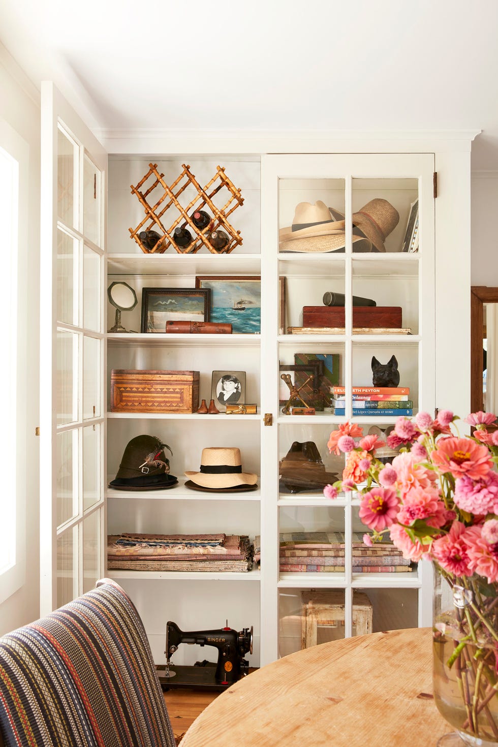 Long Island farm of antiques dealer Hadley Wiggins Marin owner of North Fork antique store North Found Co and Daniele Marin living room storage, shelving