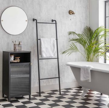stylish bathroom with tiles and a free standing bath from garden trading
