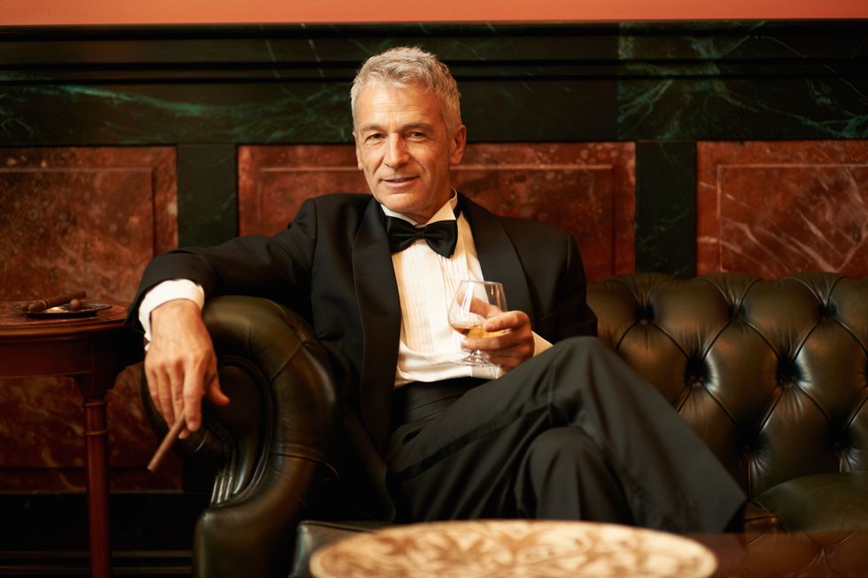 Suave man in a cigar lounge