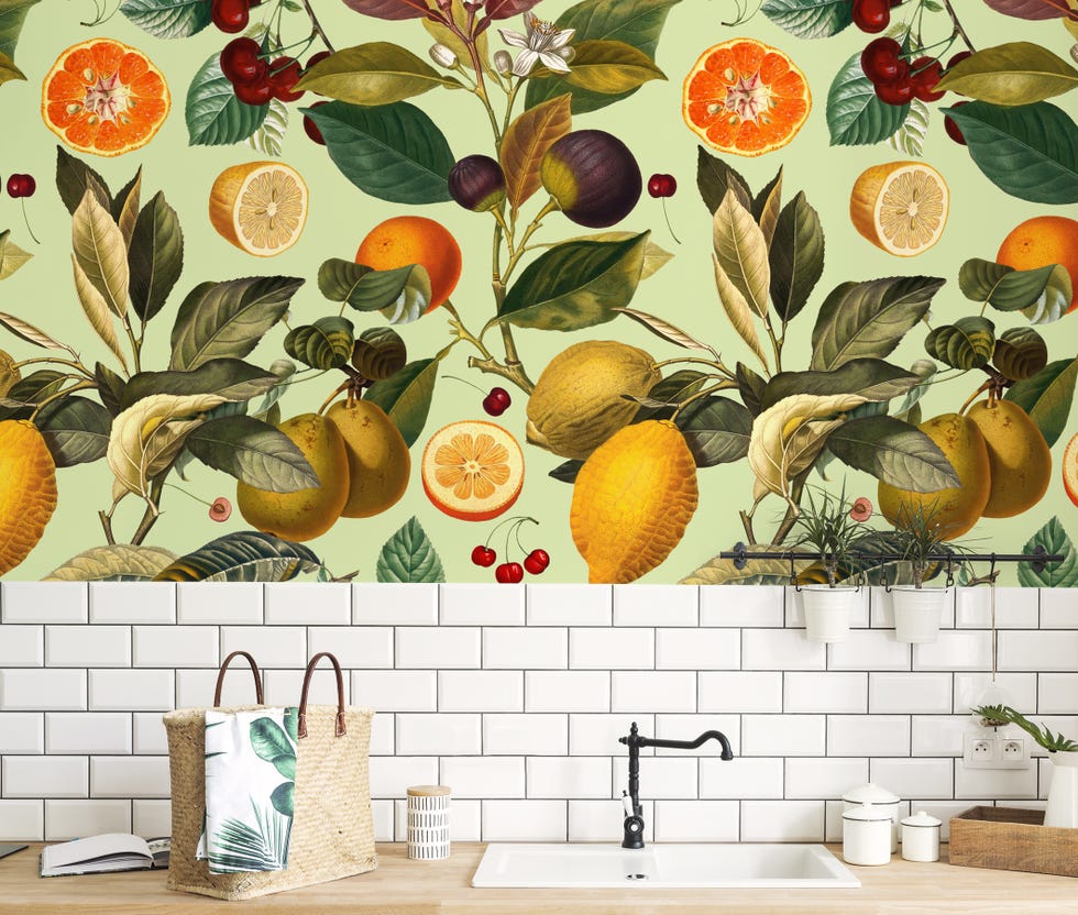 Kitchen with tiled backsplash and oversized fruit wallpaper