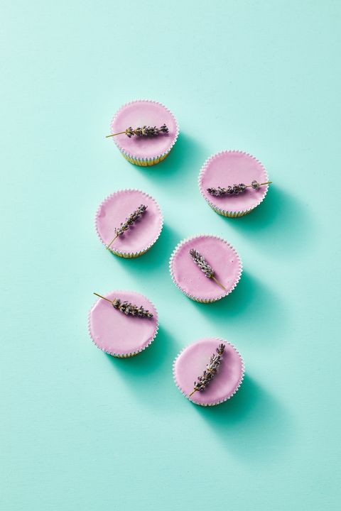 purple sugared lavender cupcakes against a teal background