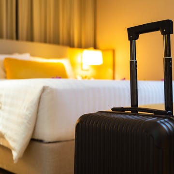 Suitcase delivered standing in hotel room. concept of Hotel service and travel suitcase delivered standing in hotel room concept of hotel service and travel
