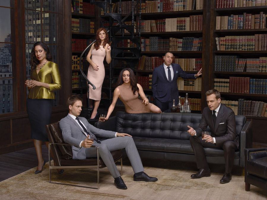 Gina Torres with the cast of Suits