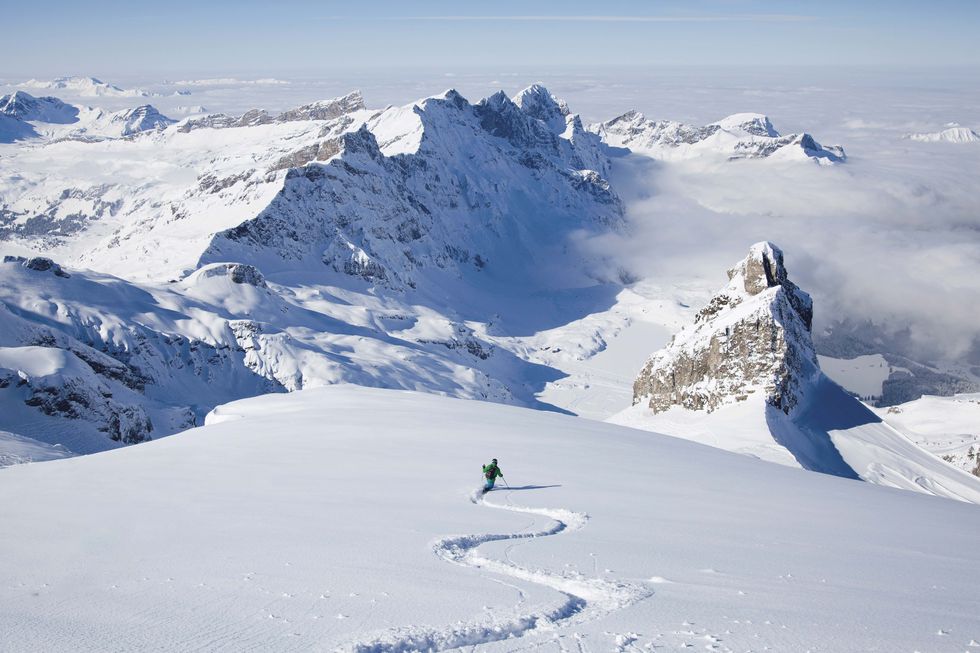 switzerland, skier in powder snow