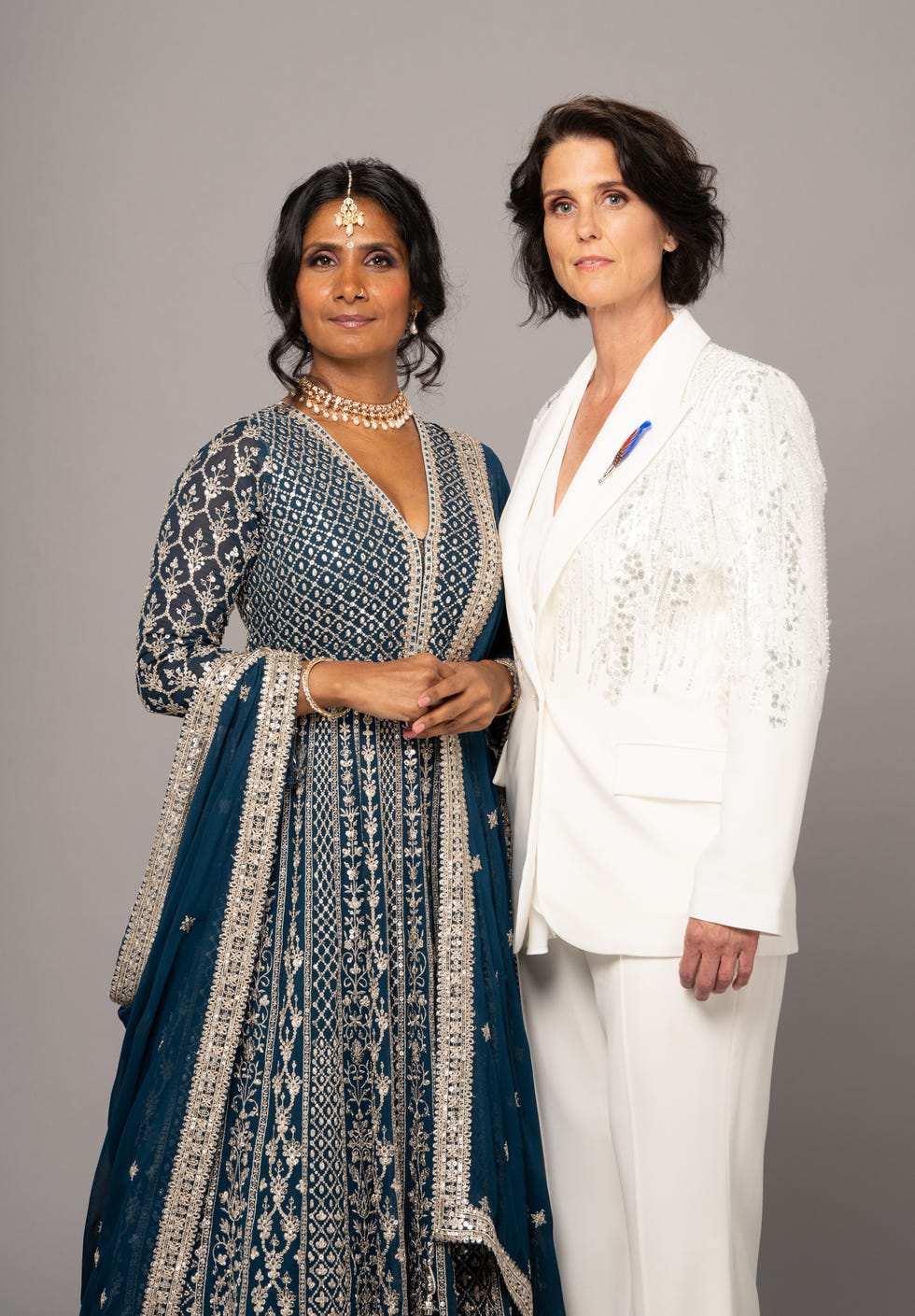 suki kaur panesar, eve unwin, pictured together in their wedding outfits in a promotional still for eastenders